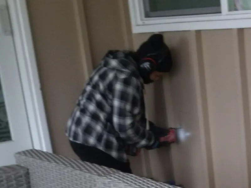 Professional electrician installing an exterior outlet in Ohio