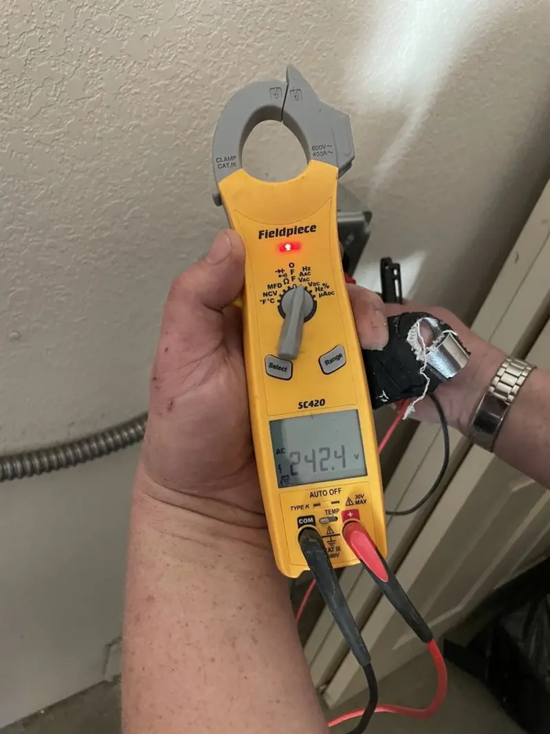 Voltage testing with clamp meter during Whole House Surge Protector in Ohio